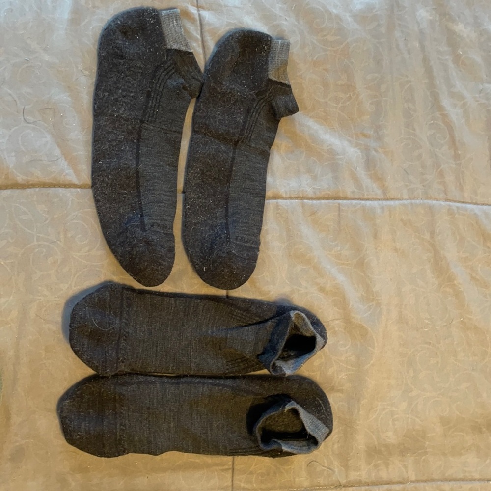 2 pairs of darn tough no show socks. Black and gray